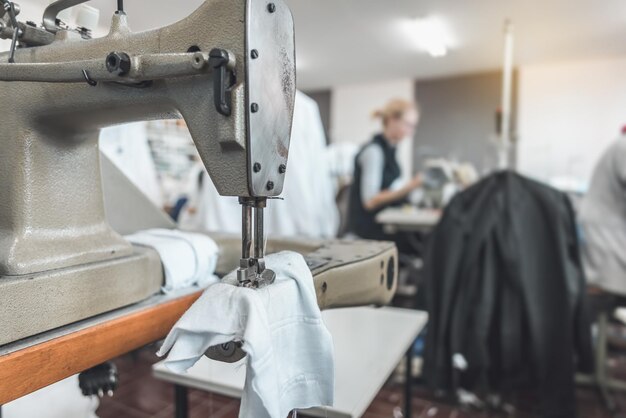 clothing-industry-workers-working-sewing-machines_1048944-2322075